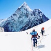 Team Of People Climbing Mount Everest