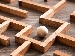 Close-up of a wooden labyrinth puzzle with a silver ball, representing the spatial logic and navigation required for 11 plus Non-Verbal Reasoning.